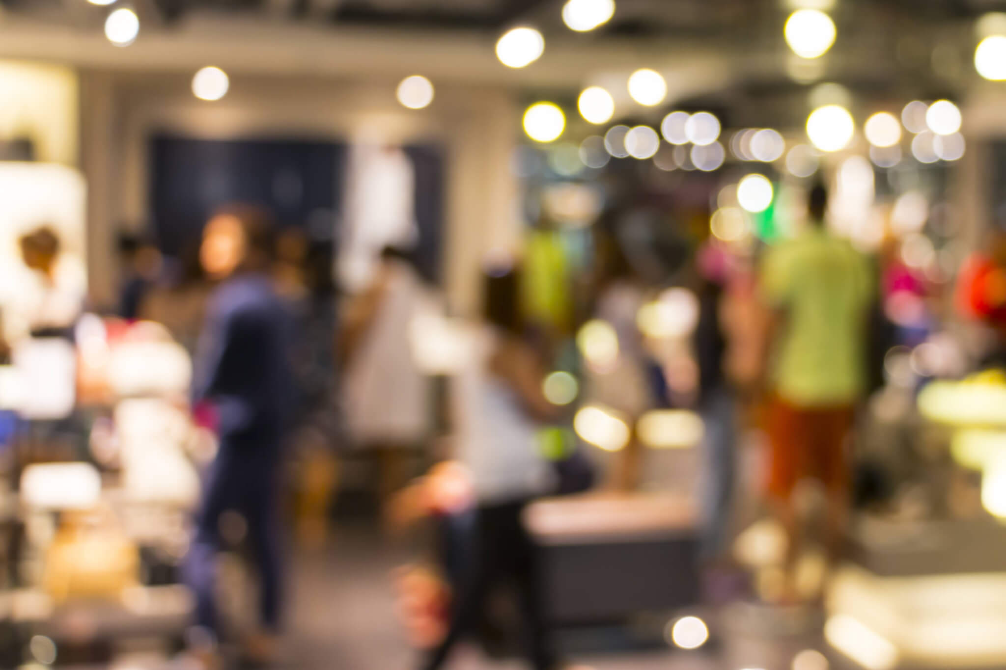 hotel gift voucher sales showing a busy blurred hotel reception scene.