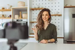 Social media influencer talking into a camera - the use of influencer marketing could help you sell gift cards